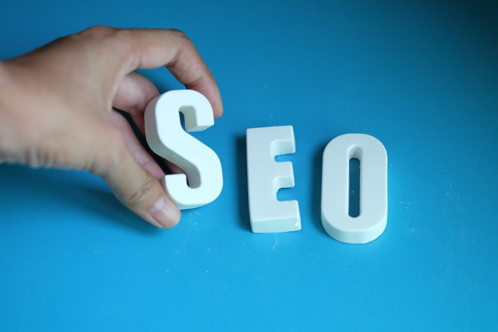 hand arrange white letter as seo